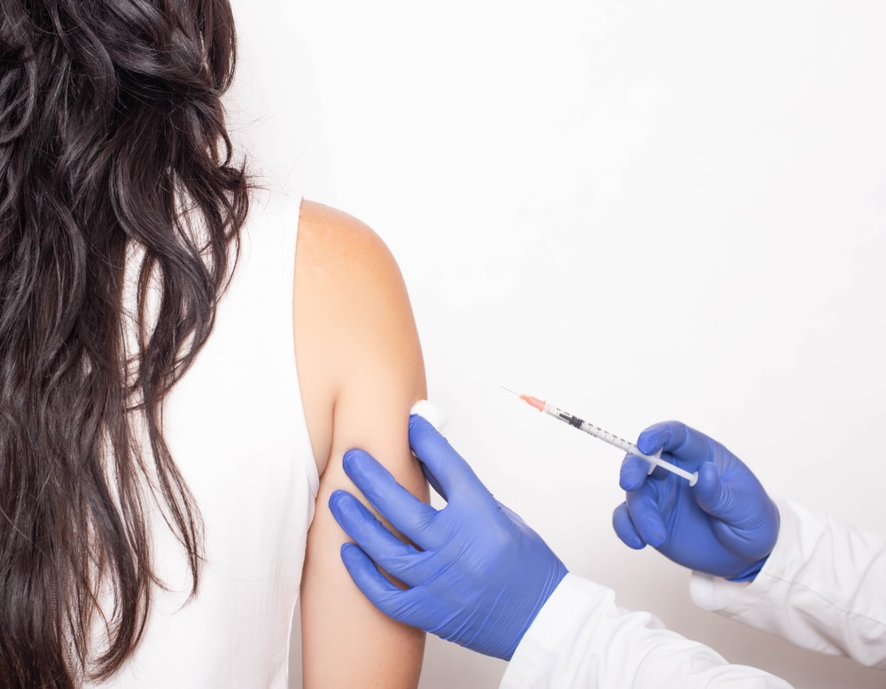 Woman getting BHRT injection in arm in Eugene, OR